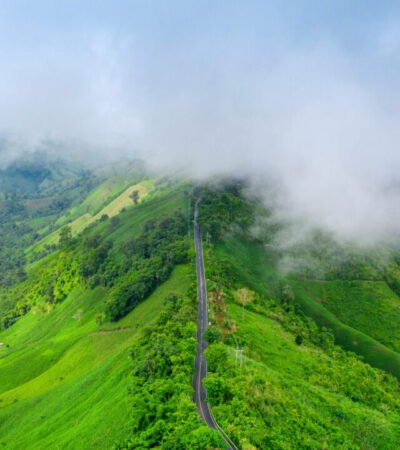 Aerial view of Beautiful sky road over top of mountains with gre