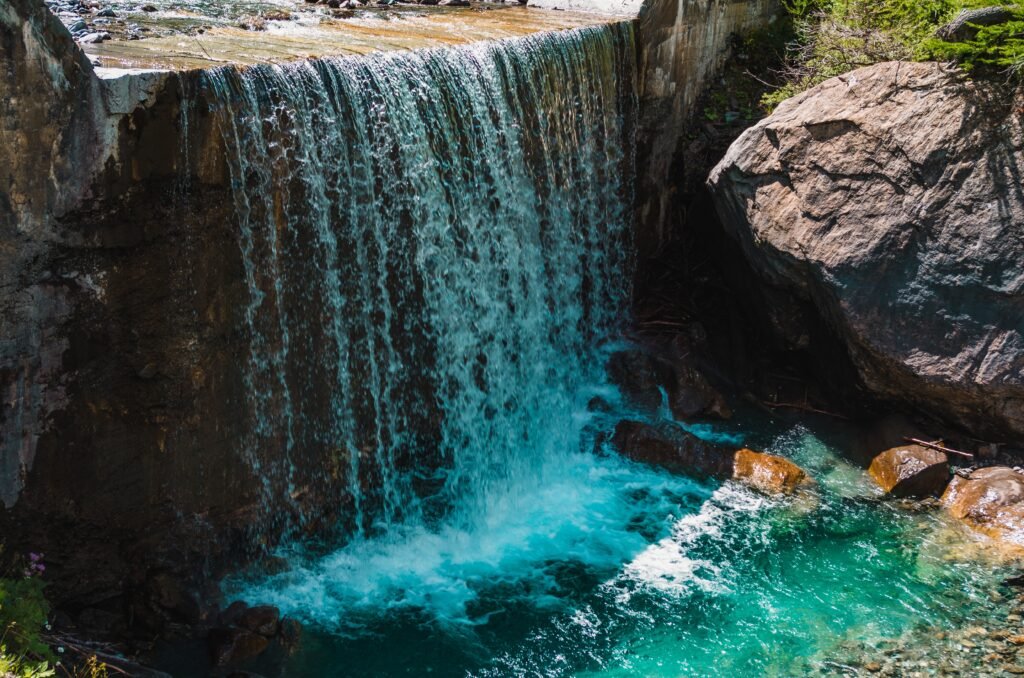 beautiful-shot-waterfall-near-huge-rock-formations-pragelato-italy